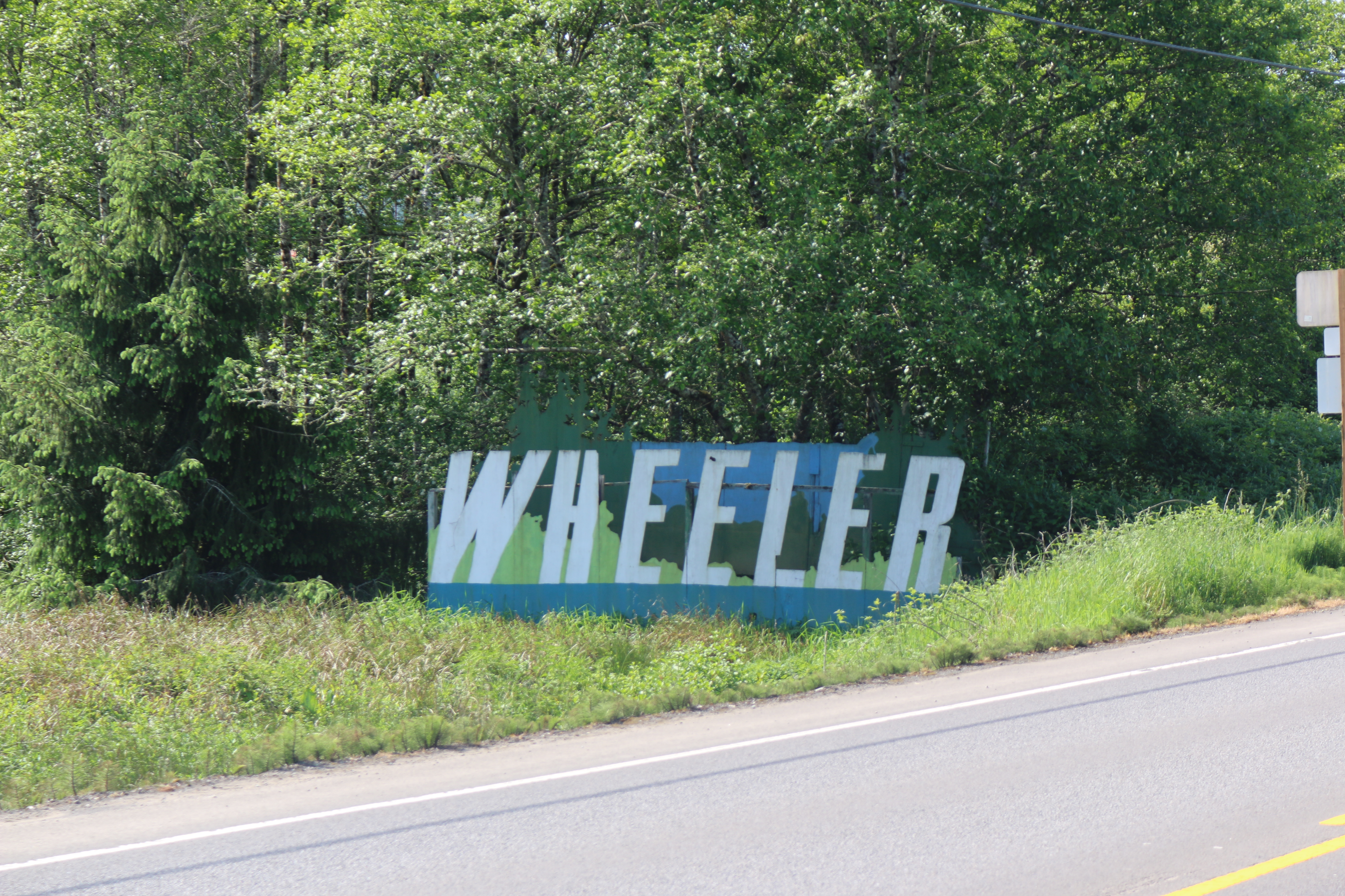 A town sign reading "Wheeler"